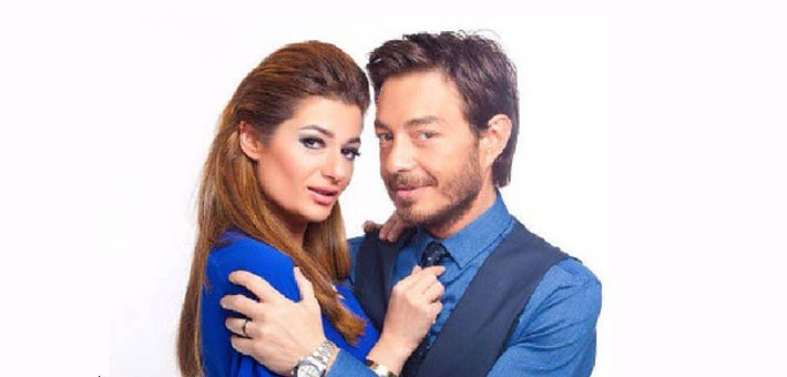 أحمد زاهر وزوجته هدى 