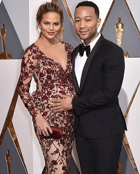 جون ليجند وزوجته عارضة الأزياء كريسي تايجن 