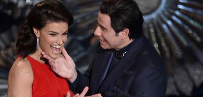 جون ترافولتا وإيدينا مينزيل