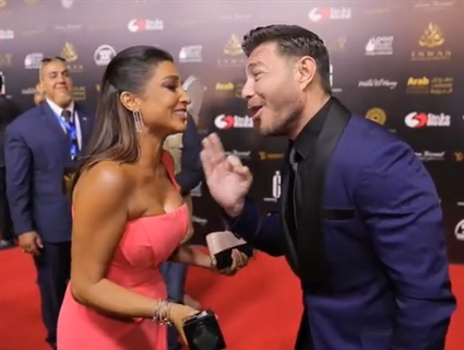 أحمد زاهر وروجينا