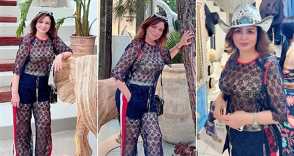 إلهام شاهين تلفت الأنظار بملابس من الدانتيل الشفاف من  Pinko في رحلتها باليونان 